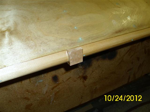 Hole plugged with scrap spruce.  To be sanded after the T-88 cures.