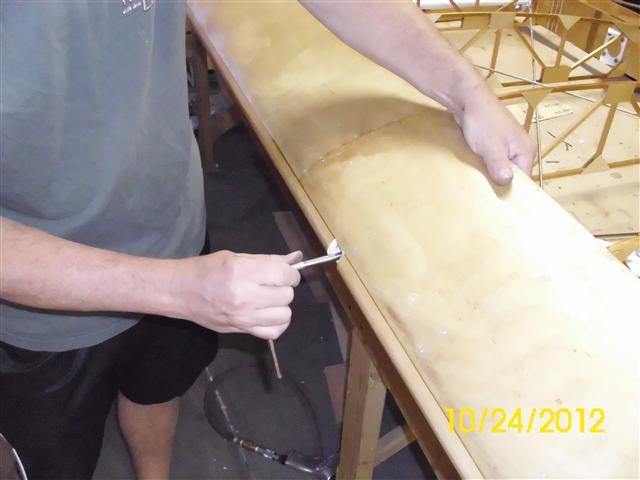 Inserting and torquing the nut.