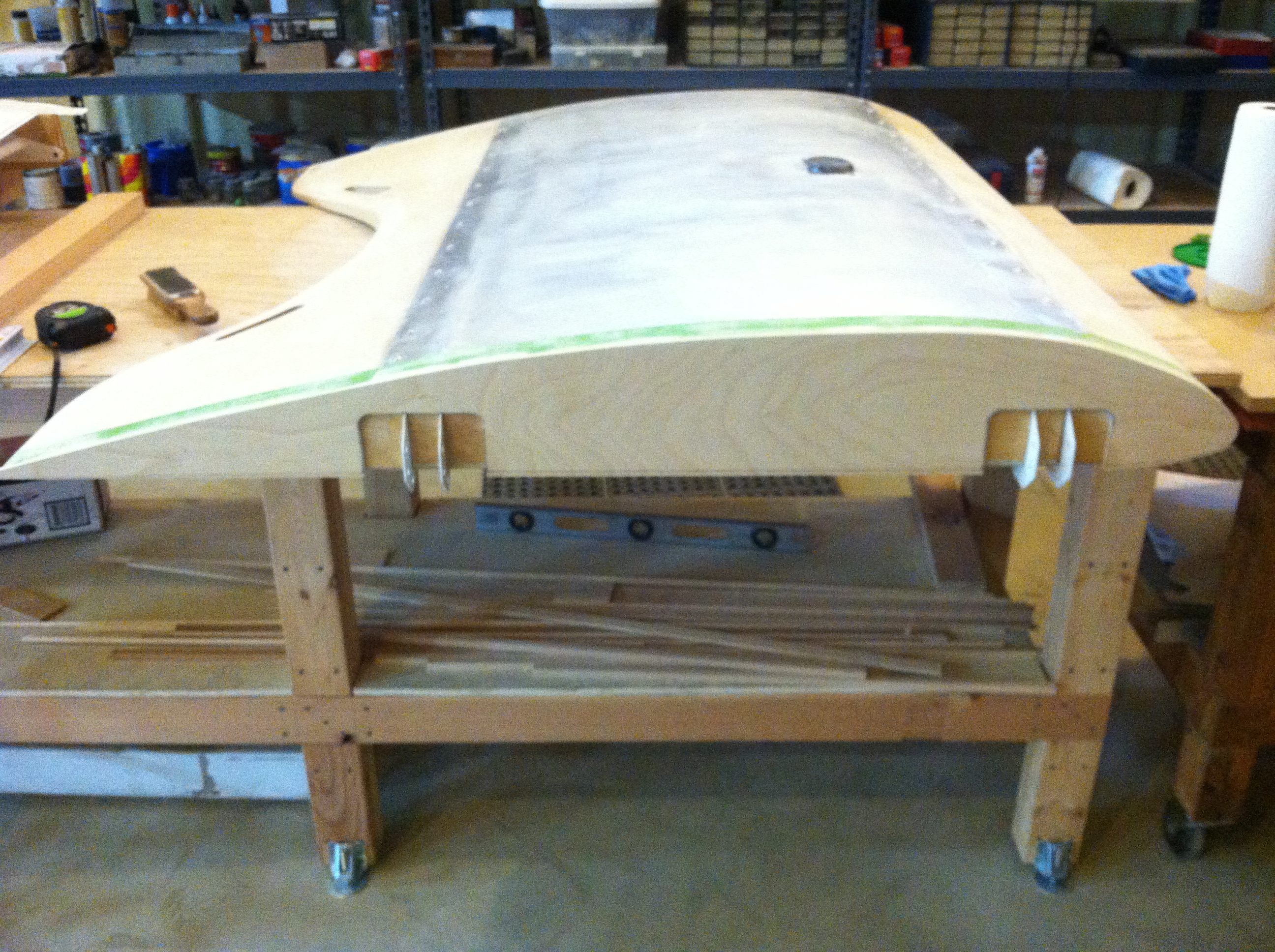Upper wing panels butt end rib fitment to center section.
